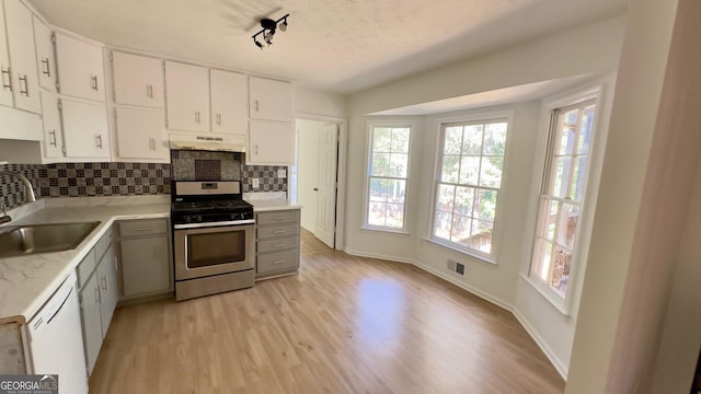 kitchen with sink, white cabinetry, white dishwasher, gas range, and light wood-type flooring