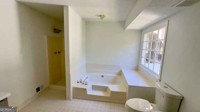 bathroom featuring tile patterned floors, plus walk in shower, and toilet