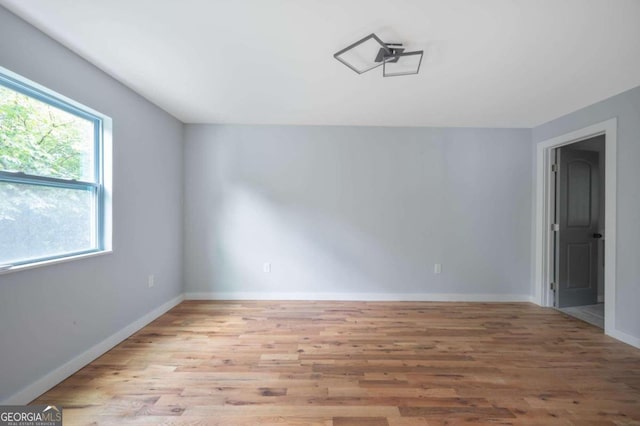 unfurnished room with light hardwood / wood-style flooring