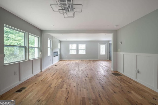 unfurnished living room with light hardwood / wood-style floors