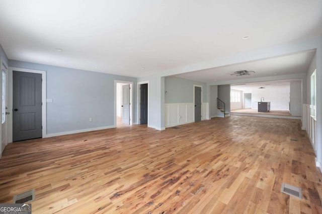 unfurnished living room with light hardwood / wood-style flooring