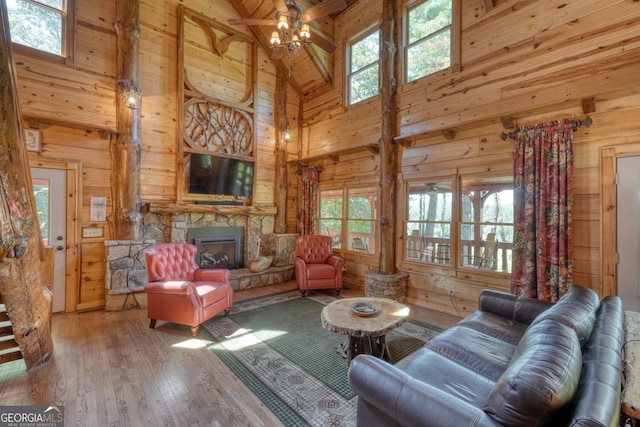 living room with a healthy amount of sunlight, hardwood / wood-style flooring, and a fireplace