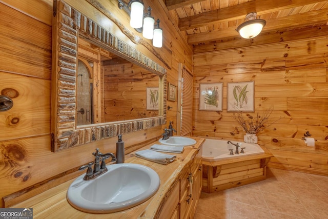 bathroom featuring wooden walls, tile patterned flooring, beam ceiling, and a tub to relax in