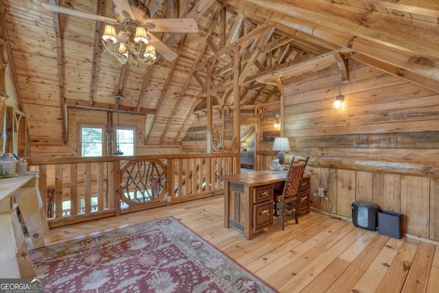 office area with wood ceiling, a chandelier, wood walls, light hardwood / wood-style flooring, and vaulted ceiling with beams