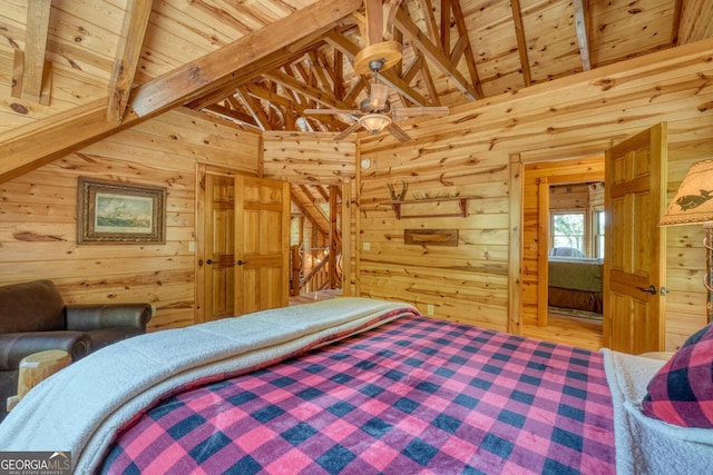 bedroom with wooden ceiling, vaulted ceiling with beams, wooden walls, and hardwood / wood-style flooring