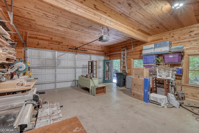 garage featuring wood ceiling, a garage door opener, and wood walls