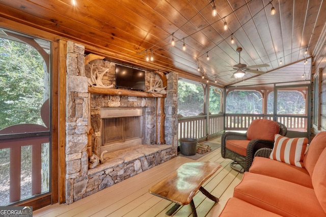 living room with hardwood / wood-style floors, wooden ceiling, and a healthy amount of sunlight