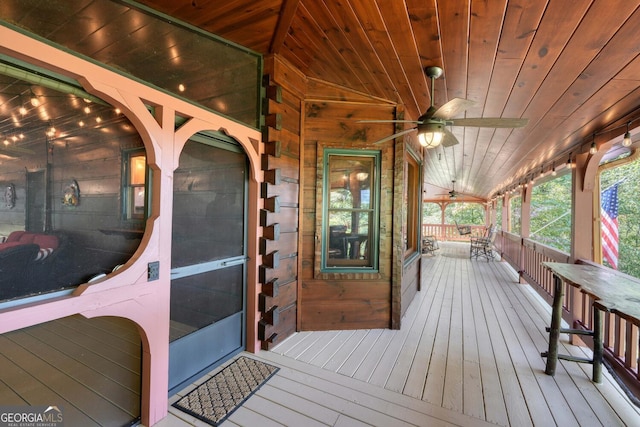 wooden deck with ceiling fan and a porch