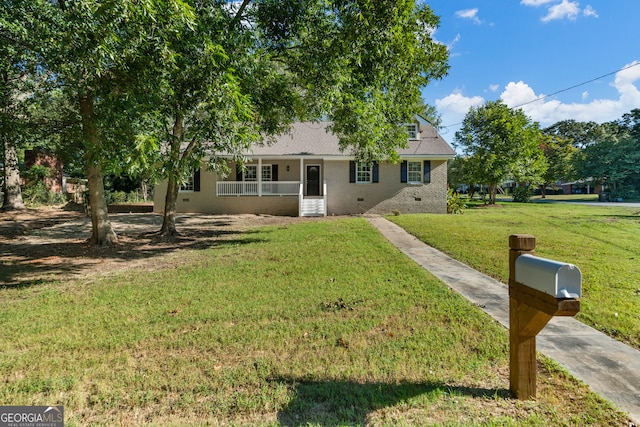 view of front of house featuring a front lawn and covered porch