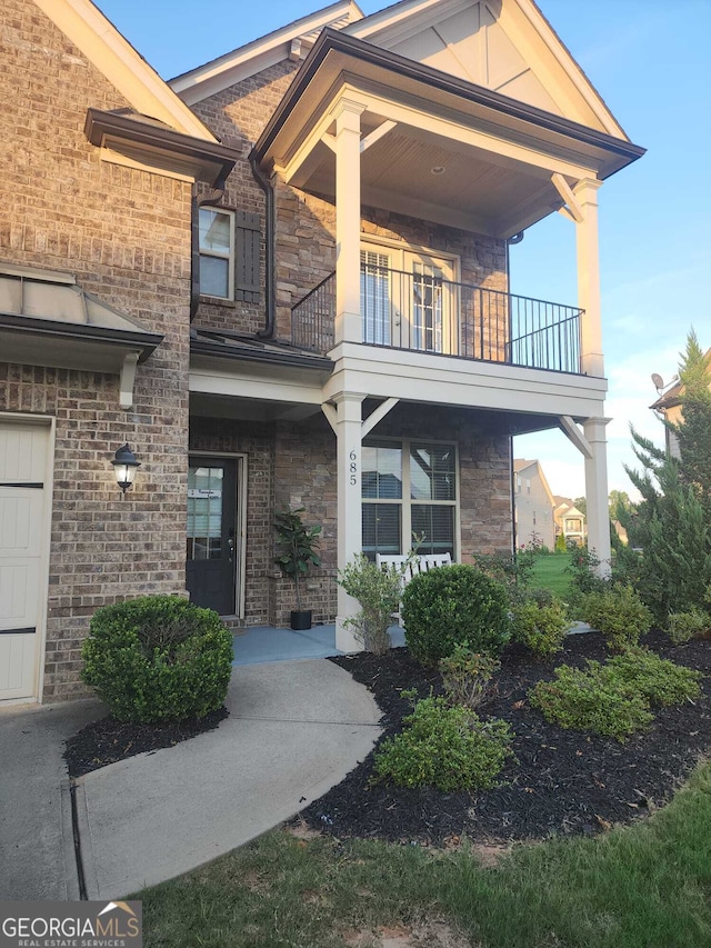 view of front of house with a balcony and a garage