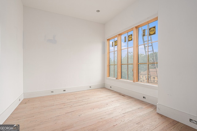 empty room with light hardwood / wood-style floors