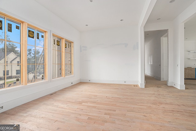 unfurnished dining area with light wood-type flooring