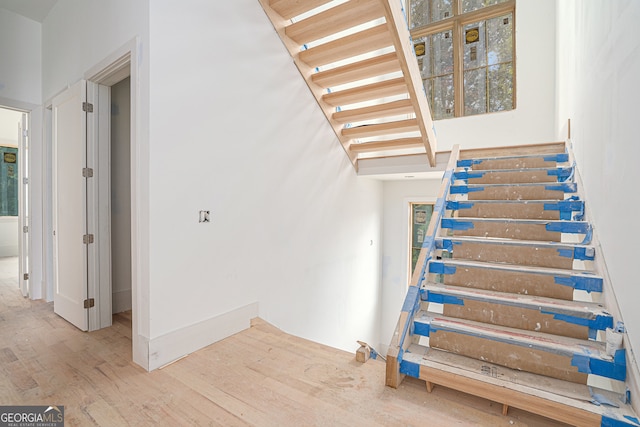 stairway with wood-type flooring