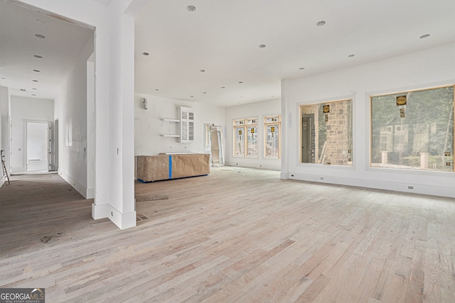 unfurnished living room with light hardwood / wood-style flooring