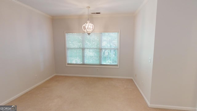 empty room featuring ornamental molding, light carpet, and a notable chandelier