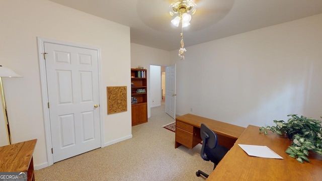 office area featuring ceiling fan and light colored carpet