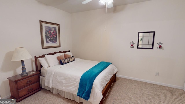 bedroom with ceiling fan and light colored carpet