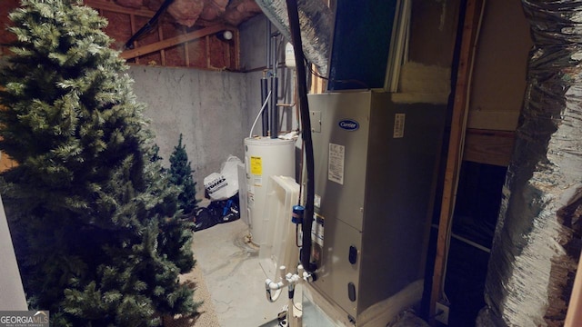 utility room featuring water heater