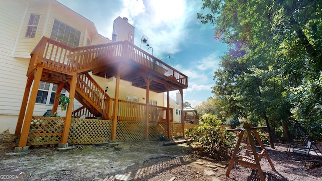 view of property exterior featuring a wooden deck