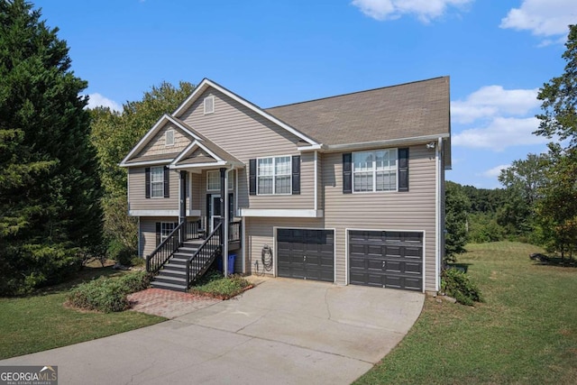 bi-level home featuring a front yard and a garage