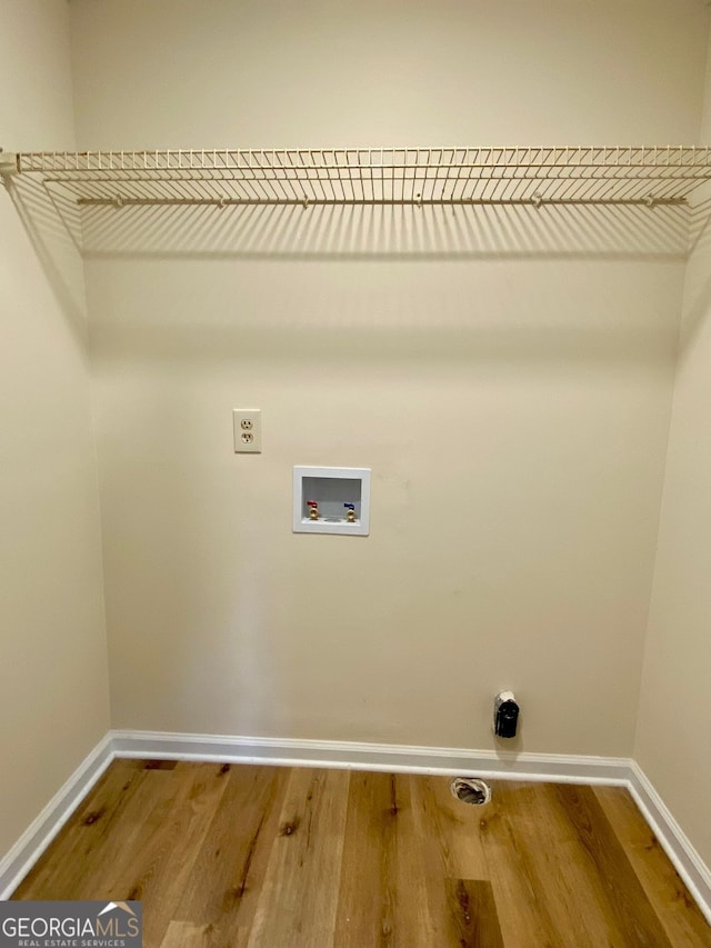 laundry room featuring wood-type flooring, hookup for an electric dryer, and hookup for a washing machine