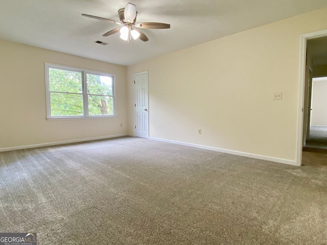 unfurnished room featuring carpet and ceiling fan