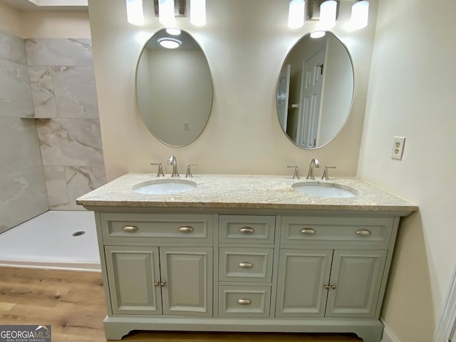 bathroom with wood-type flooring and vanity