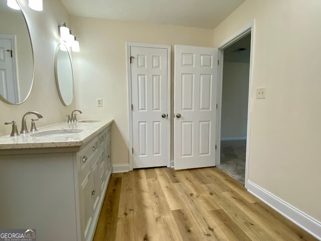 bathroom featuring hardwood / wood-style floors and vanity