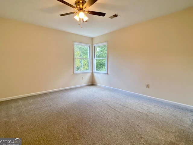 carpeted empty room with ceiling fan