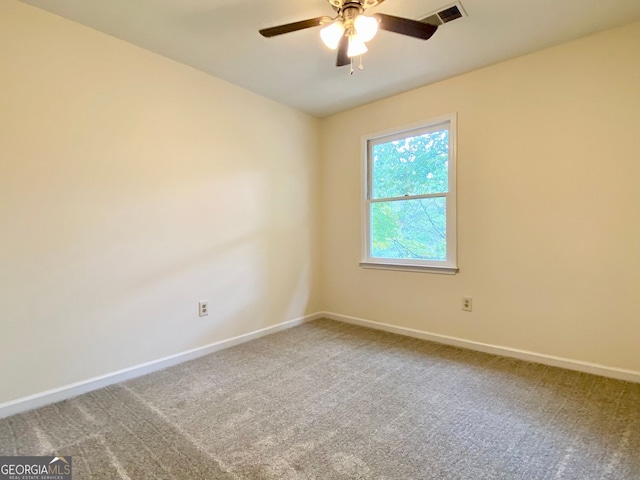 empty room featuring ceiling fan and carpet floors