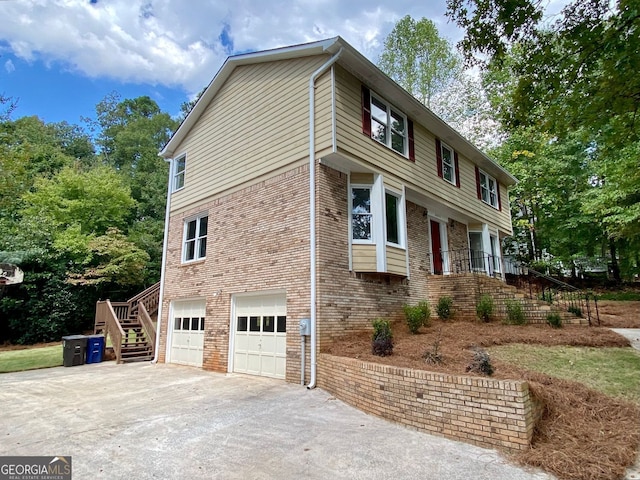 view of side of property featuring a garage