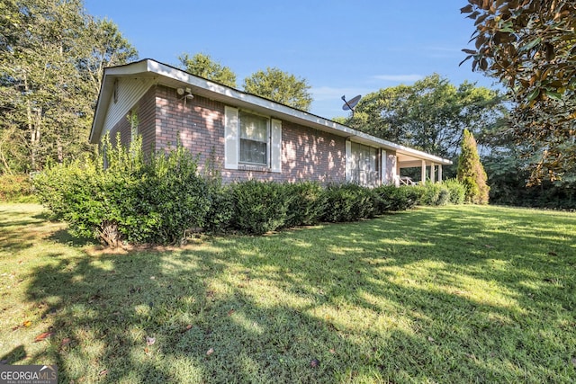 view of home's exterior with a yard