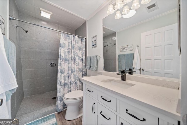 bathroom featuring hardwood / wood-style flooring, toilet, crown molding, curtained shower, and vanity