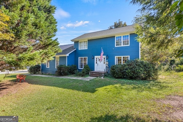 view of front of home with a front yard