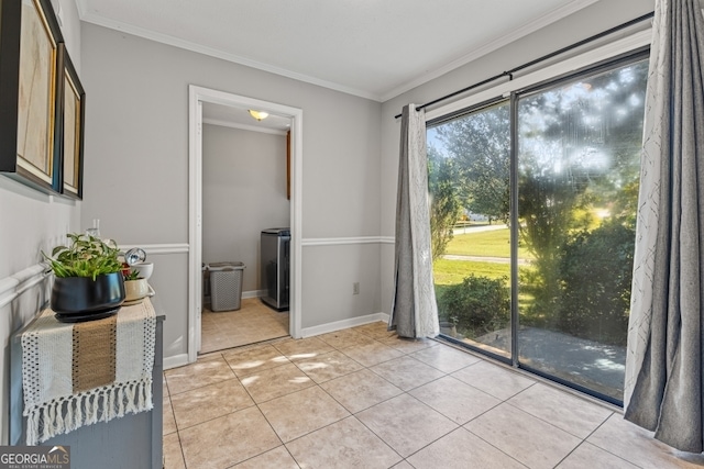 interior space with washer / clothes dryer and ornamental molding