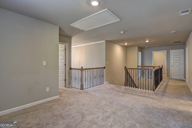 empty room with light colored carpet