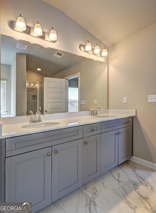 bathroom featuring lofted ceiling, an enclosed shower, and vanity