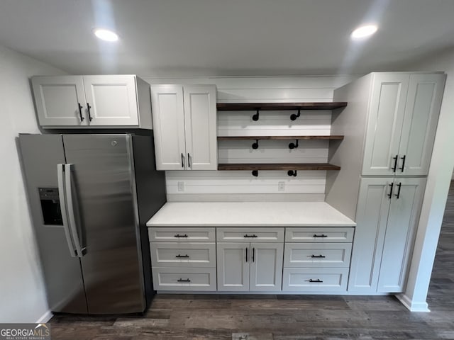 clothes washing area featuring washer hookup, cabinets, dark hardwood / wood-style floors, and electric dryer hookup