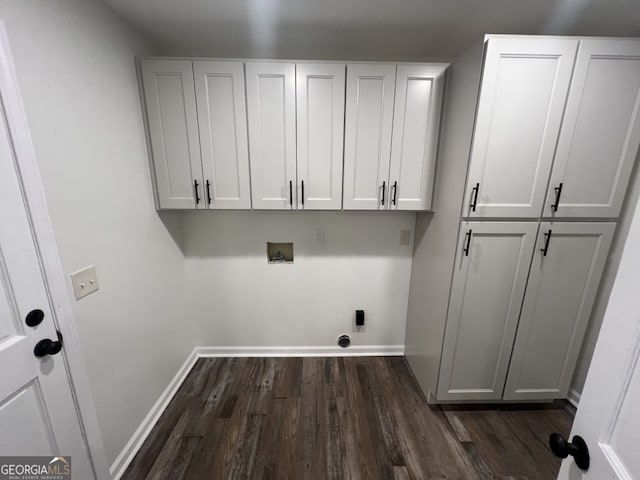 spare room featuring ceiling fan and dark wood-type flooring