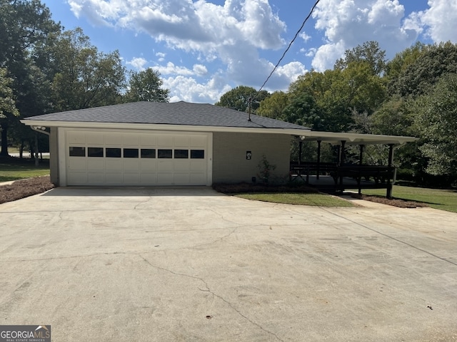 view of property exterior with a garage and a yard