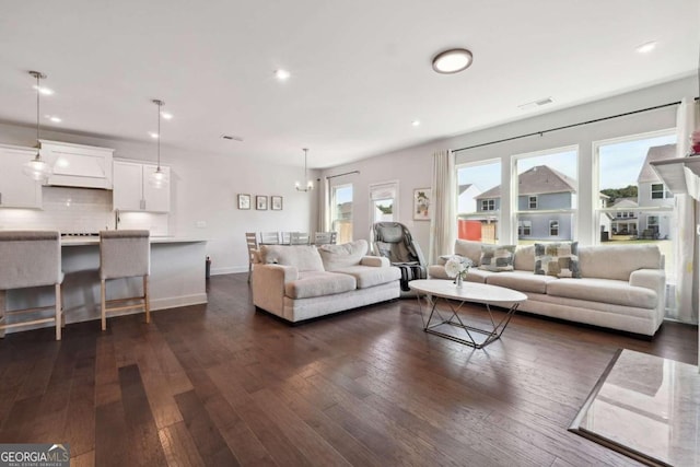 living room with dark hardwood / wood-style flooring