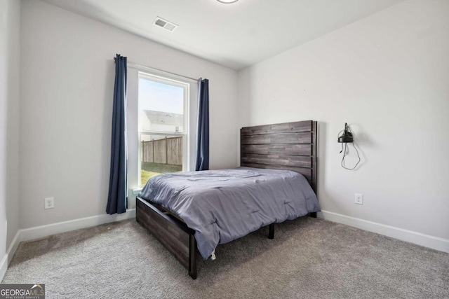 bedroom with light colored carpet