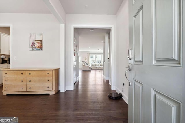 corridor featuring dark wood-type flooring