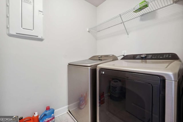 laundry area featuring washer and clothes dryer and electric panel