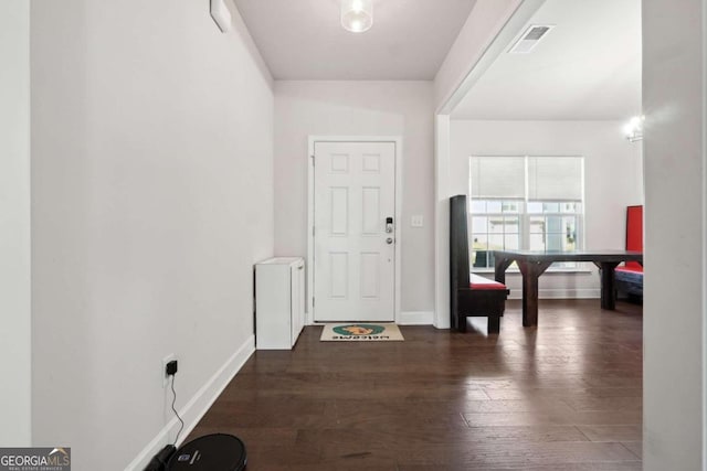 foyer entrance with dark hardwood / wood-style flooring