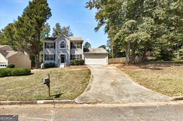 view of front facade featuring a garage and a front lawn