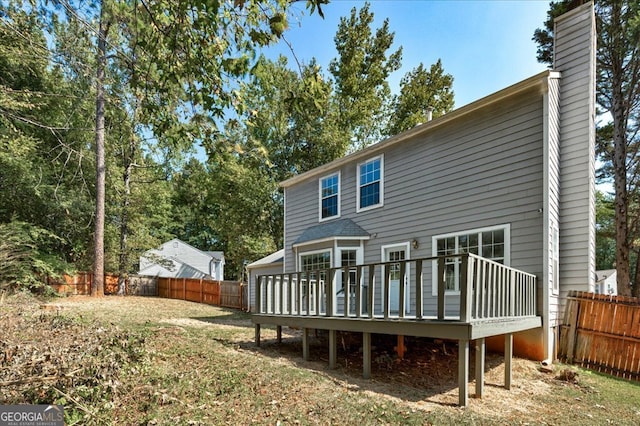 back of house featuring a deck