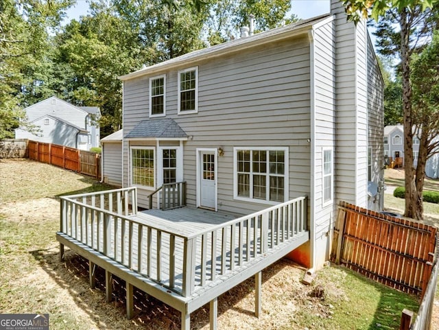 rear view of house with a wooden deck