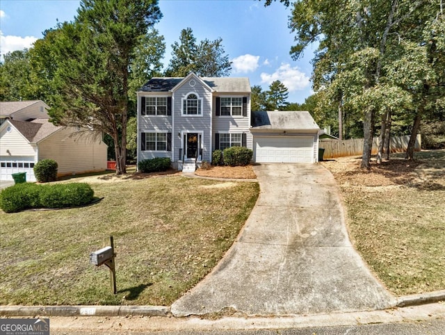 colonial-style house with a garage and a front yard