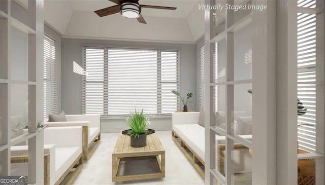 bathroom with lofted ceiling and ceiling fan